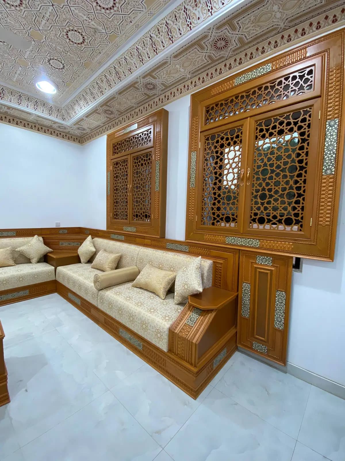 Hand-carved mashrabiya woodwork in a custom majlis